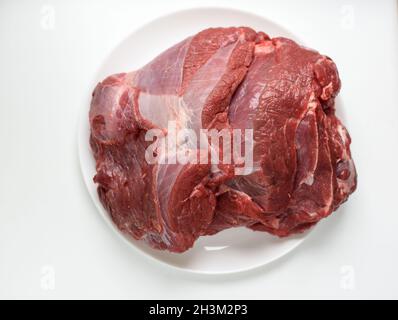 large piece of raw beef on wooden background Stock Photo
