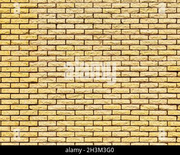 Yellow decorative brick wall texture. Abstract background for design. Stock Photo