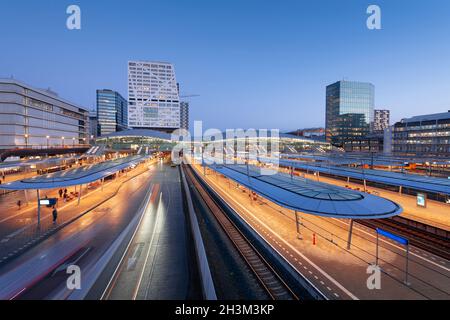 Utrecht, Netherlands cityscape over train station platforms at dawn. Stock Photo