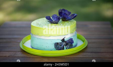 Birthday fancy colorful cake with flowers and confetti Stock Photo - Alamy