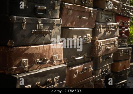 Vintage weathered leather suitcases on top of eachother Stock Photo