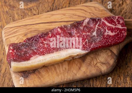 Raw steak on olive wood Stock Photo