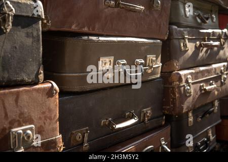 Vintage weathered leather suitcases on top of eachother Stock Photo