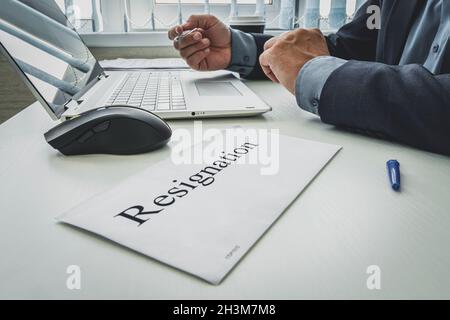 Resignation letter. Resignation letter in brown envelope. concept of termination of the contract. Resignation or job change. The boss signed a letter Stock Photo