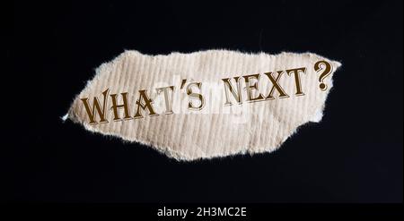What's next The text is written on torn brown paper Stock Photo