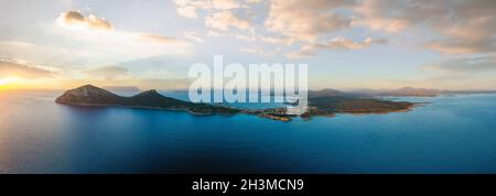 View from above, aerial shot, stunning panoramic view of Golfo Aranci during a beautiful sunrise. Stock Photo
