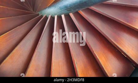 Modern spiral staircase made from wood in selective focus Stock Photo