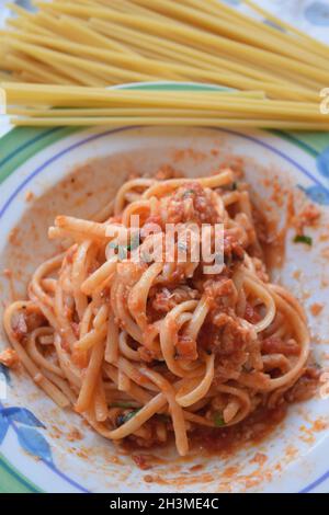 spaghetti alla puttanesca typical dish of Neapolitan cuisine Stock Photo