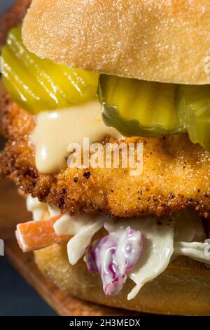 Homemade German Chicken Schnitzel Sandwich with Chips Stock Photo