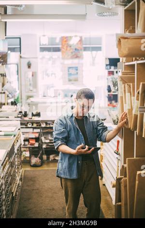 Male entrepreneur using digital tablet at office Stock Photo