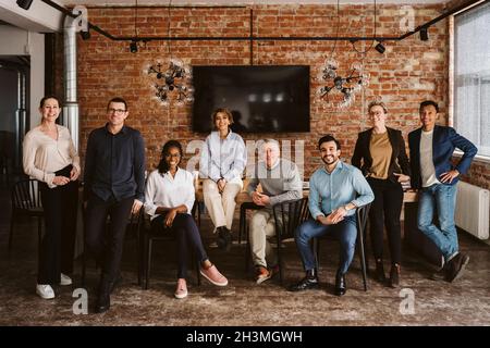 Full length of portrait of multi-ethnic creative team in board room Stock Photo