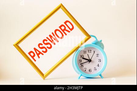 The word Password is written on the photo frame next to the alarm clock and on a white background. With copy space. Stock Photo