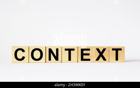 CONTEXT Word written on wooden cubes and a white background. Stock Photo