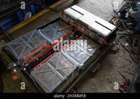 High voltage batteries from an electric car. Disassembled battery of vehicle Nissan Leaf. Service station, service of electric c Stock Photo