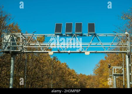 Weight control post with cameras fixing speed and weights. Solar panels are installed on the structure of the post. The concept of safety on the roads Stock Photo