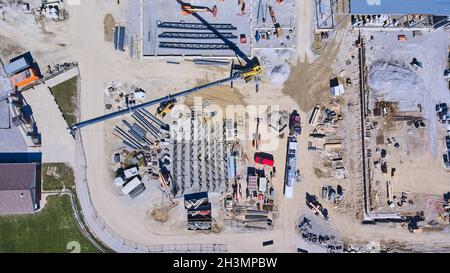 Aerial of large construction site with equipment and workers Stock Photo