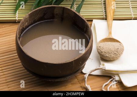 Kava drink made from the roots of the kava plant mixed with water Stock Photo