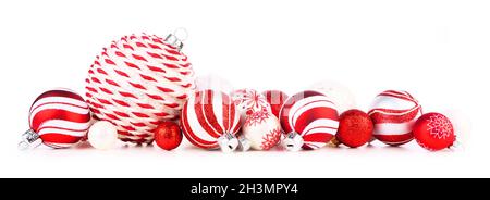 Christmas border of red and white ornaments. Side view isolated on a white background. Stock Photo