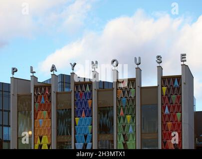 The brightly coloured facade of the new west yorkshire playhouse theatre building against a bright cloudy blue sk Stock Photo