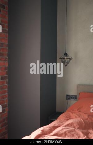 Vase with comfortable sofa near brick wall indoors Stock Photo Alamy