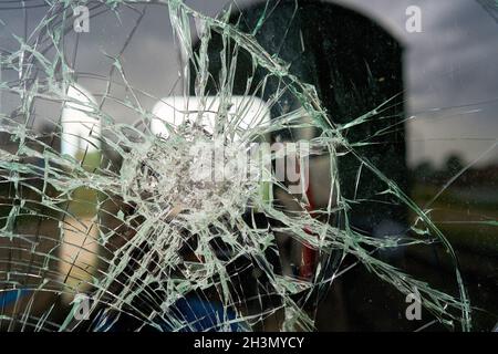 Destroyed glass of the window pane of a railway wagon Stock Photo