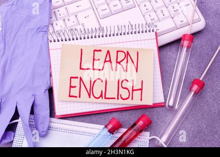 Sign displaying Learn English. Business idea gain acquire knowledge in new language by study Typing Medical Notes Scientific Studies And Treatment Stock Photo