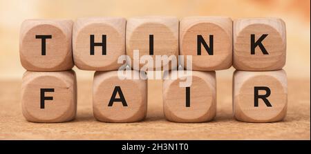Think fair printed on wooden cubes Stock Photo