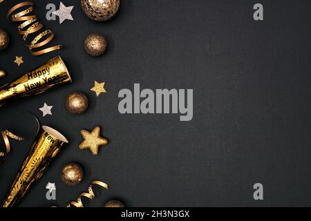 New Years Eve side border of gold and black confetti, streamers and ...