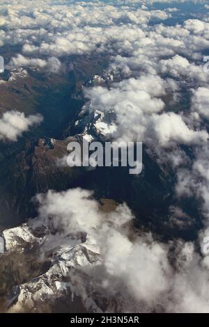 Mountain range under clouds, aerial survey. Caucasus, Krasnodar Territory, Russia