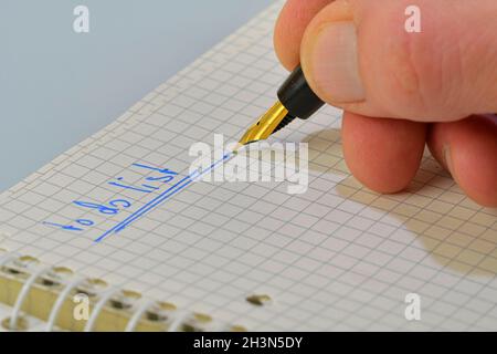 Man hand writing text -to do list- in notebook. Copy space. Concept of duties, resolutions Stock Photo