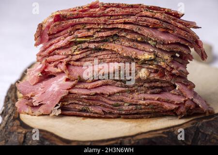 Stack of sliced pastrami meat Stock Photo