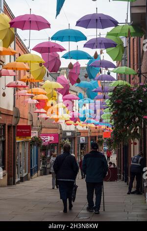 Grand display of hanging umbrellas  in the umbrella street in Bishops Shopping Centre  County Durham England UK Stock Photo