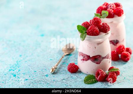 Jars of homemade berry yogurt. Stock Photo