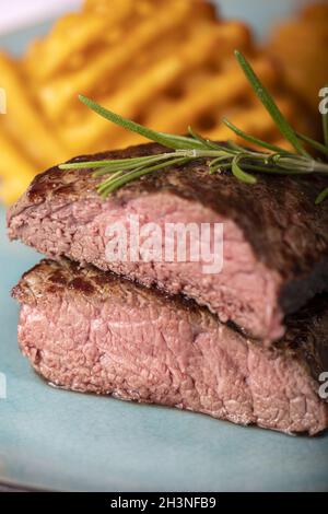 Grilled steak with fresh potato grids Stock Photo - Alamy