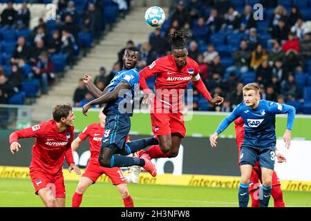 Sinsheim, Germany. 29th Oct, 2021. Football: Bundesliga, TSG 1899 Hoffenheim - Hertha BSC, Matchday 10, at PreZero Arena. Hoffenheim's Ihlas Bebou (M, l) and Hertha's Dedryck Boyata in a header duel. Credit: Uwe Anspach/dpa/Alamy Live News Stock Photo