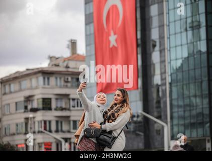 Istanbul, Turkey. 29th Oct, 2021. People celebrate as they watch a procession during the Turkish Republic Day celebration in Istanbul, Friday, October 29, 2021. Turkey celebrates the 98th anniversary of the founding of the modern Turkish Republic founded by Ataturk. (Credit Image: © Abed Alrahman Alkahlout/Quds Net News via ZUMA Press Wire) Stock Photo