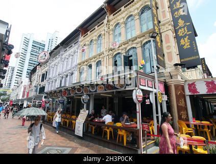 A Chinese restaurant at the juncture between Pagoda Street and Trengganu Street with several people in the Chinatown District, Singapore. Stock Photo