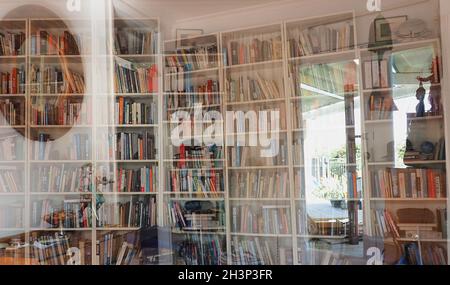 Bookshelves and artworks in a living room, multiple exposure Stock Photo