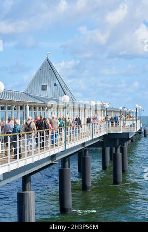 Tourists on the pier of Heringsdorf on the German Baltic coast Stock Photo
