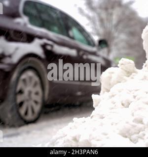 Blurred car with motion blur on a slippery road in winter Stock Photo