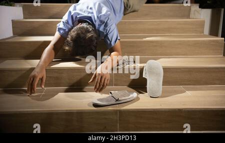 Senior man falling down stair by hypertension Stock Photo