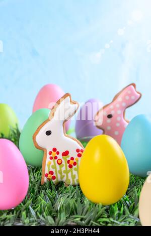 Easter eggs and gingerbread cakes in the shape of bunnies. Stock Photo