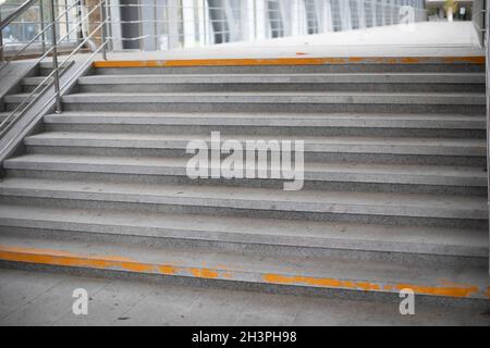 Stairs in the pedestrian crossing. Steps made of stone. A place to lift people on foot. Stock Photo