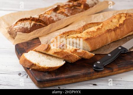 Baked bread on wooden table Stock Photo