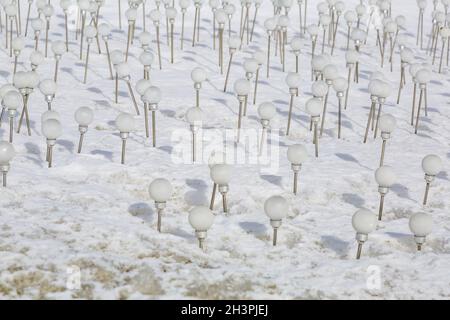 White eco-friendly solar lamps in the snow Stock Photo