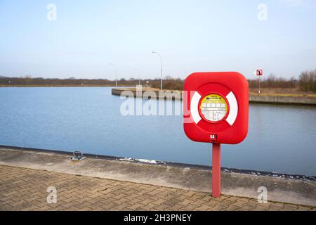 Life ring as safety equipment on the Mittelland Canal near the ship lift at Magdeburg in Germany Stock Photo
