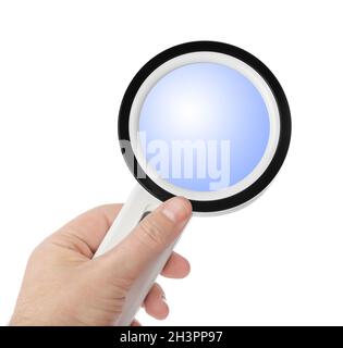 Magnifying glass in hand Stock Photo
