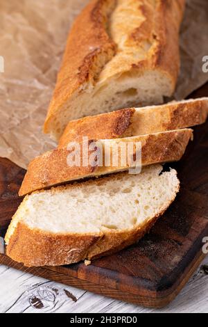 Baked bread on wooden table Stock Photo