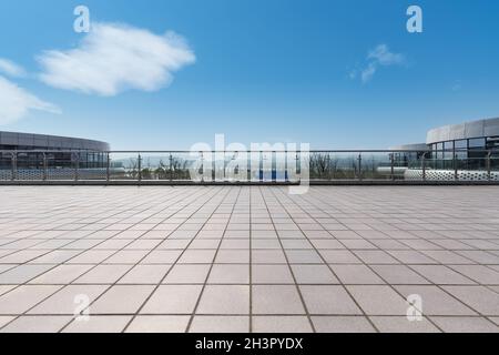 Modern cityscape with empty brick floor Stock Photo