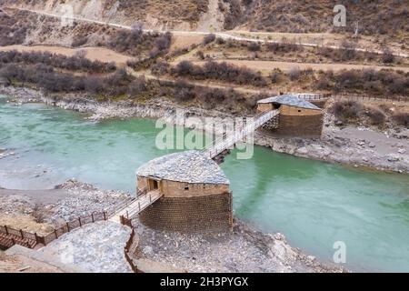 Tibetan style wooden overhanging bridge Stock Photo